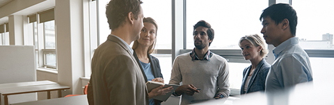 Group of professionals discussing 403(b) plans.